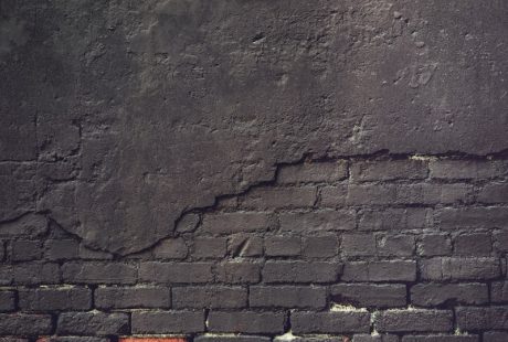 an old brick wall with a grungy surface